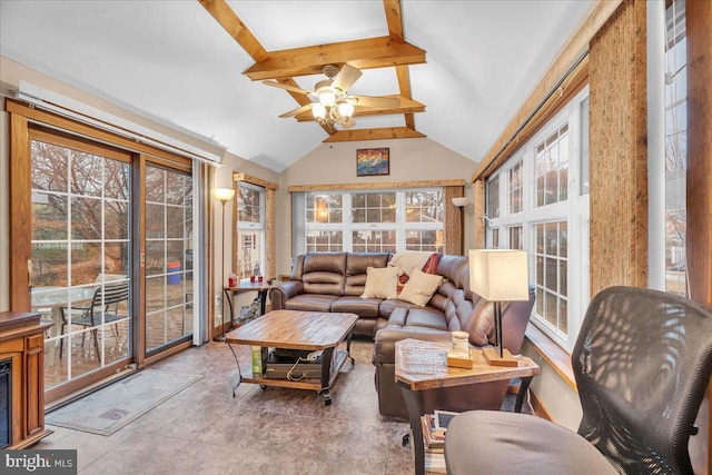 sunroom / solarium with ceiling fan and vaulted ceiling with beams