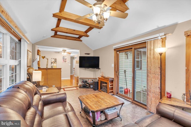 living room featuring ceiling fan and lofted ceiling with beams