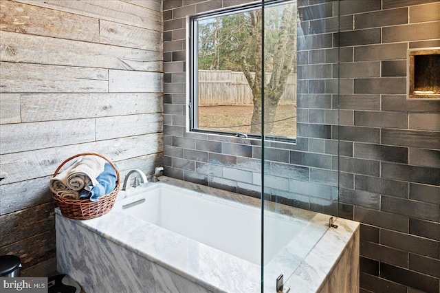 bathroom featuring a garden tub