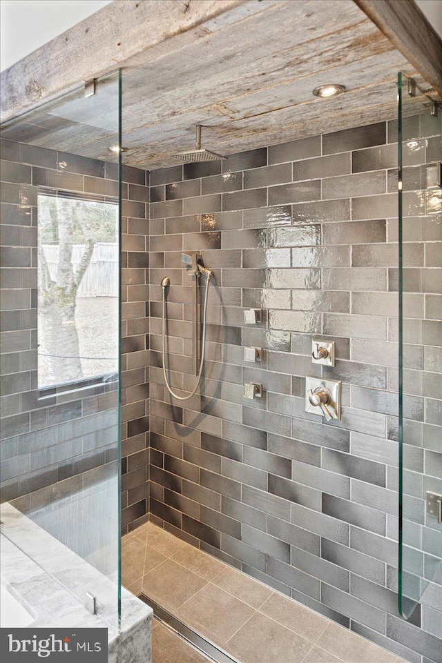 bathroom with tiled shower