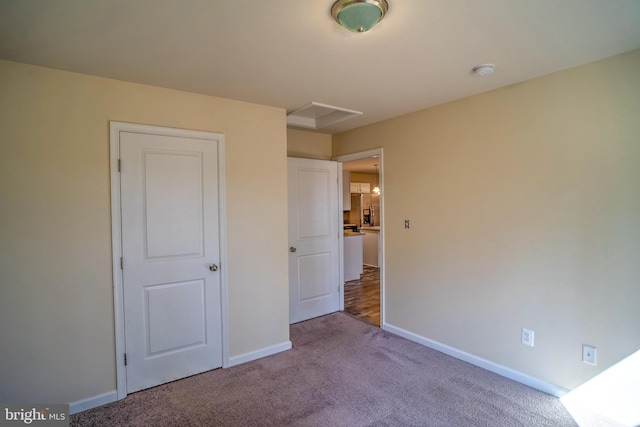 unfurnished bedroom with carpet floors