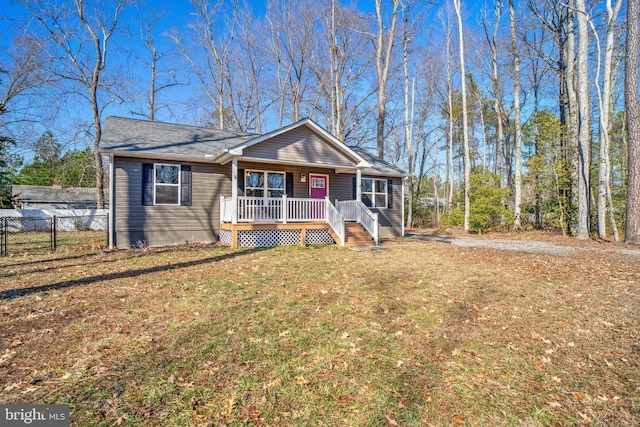 ranch-style house with a front lawn and a porch