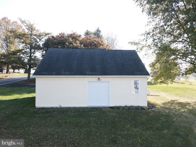 garage with a yard