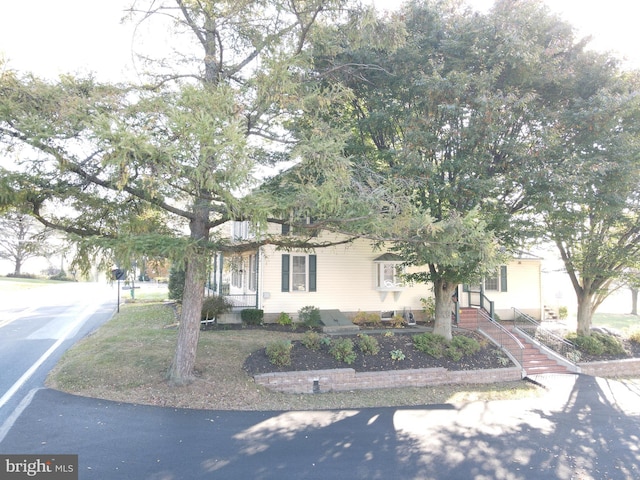 view of property hidden behind natural elements