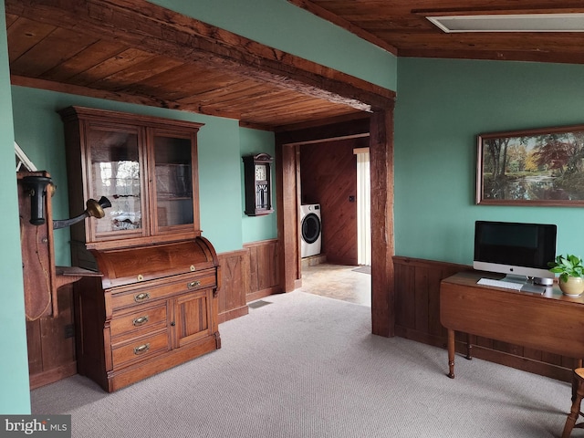 carpeted home office with washer / dryer, wooden walls, and wood ceiling