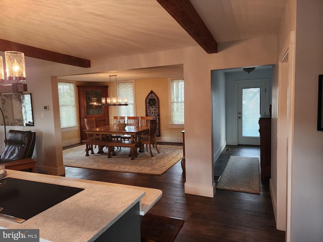 dining room with dark hardwood / wood-style flooring and beamed ceiling