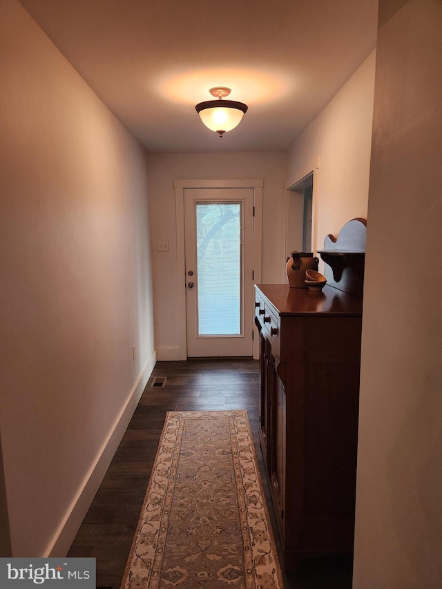 doorway featuring dark hardwood / wood-style floors