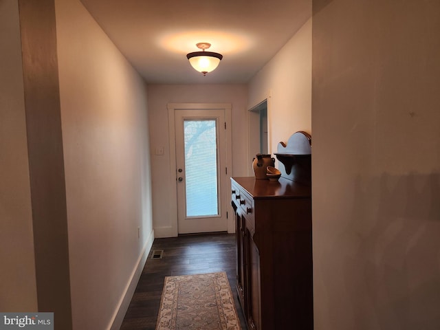 doorway featuring dark hardwood / wood-style floors