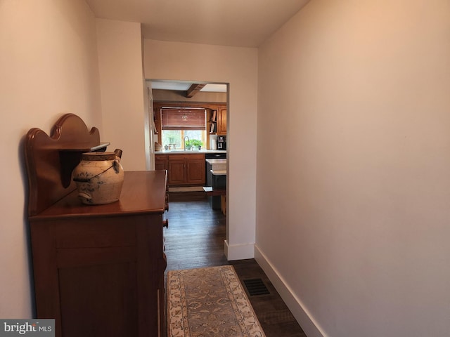 hall with sink and dark hardwood / wood-style flooring