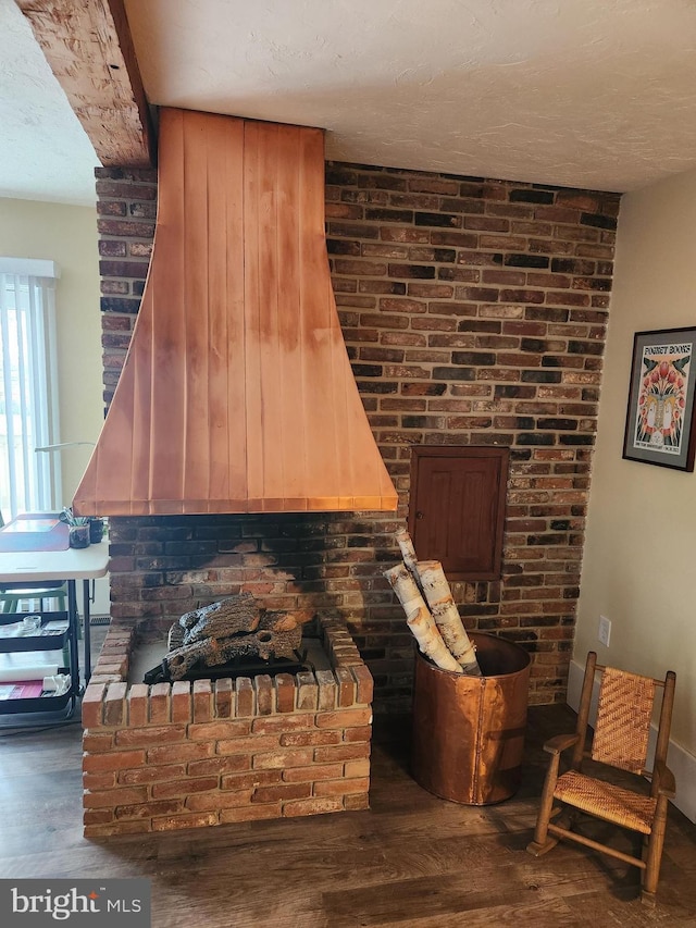 interior details with hardwood / wood-style floors and a textured ceiling