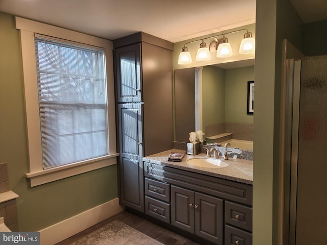 bathroom featuring vanity, hardwood / wood-style floors, and a shower with door