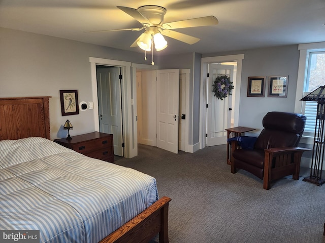 bedroom with dark colored carpet and ceiling fan