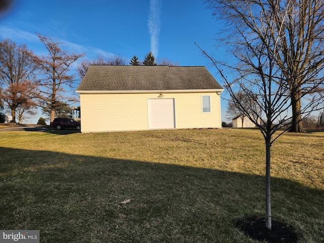 view of side of home with a lawn