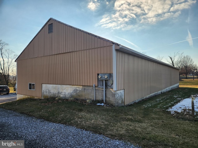 view of side of property with a lawn