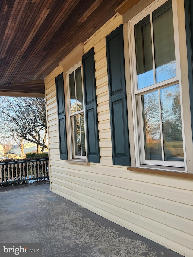 view of property exterior with a porch