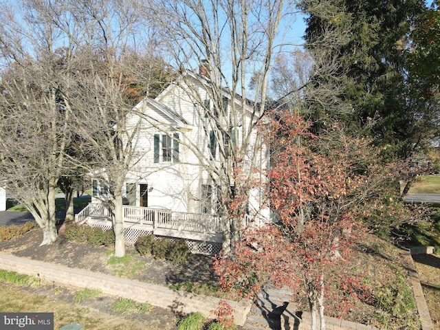 view of side of property with a deck