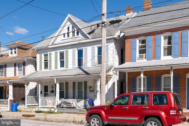 townhome / multi-family property with covered porch