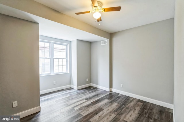 empty room featuring ceiling fan and wood-type flooring