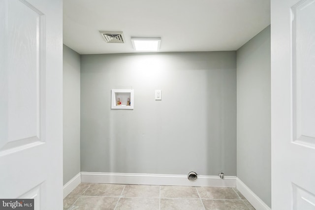 laundry room with light tile patterned flooring, washer hookup, and gas dryer hookup