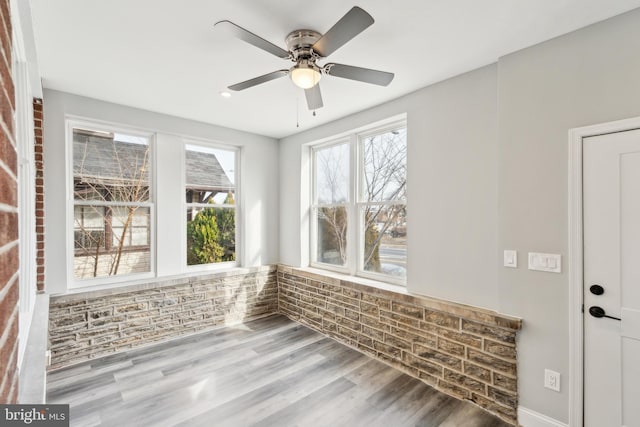 interior space featuring ceiling fan