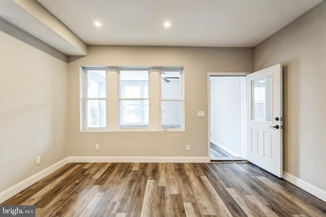 entryway with hardwood / wood-style flooring