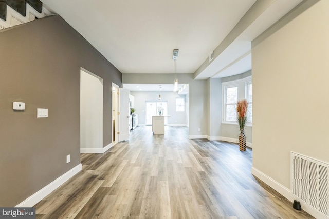 corridor featuring hardwood / wood-style flooring