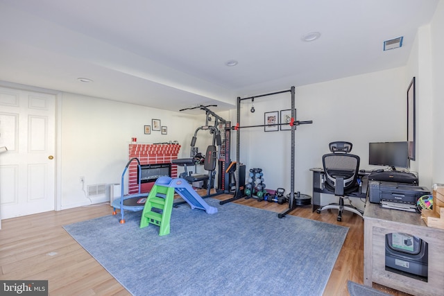 recreation room with wood-type flooring