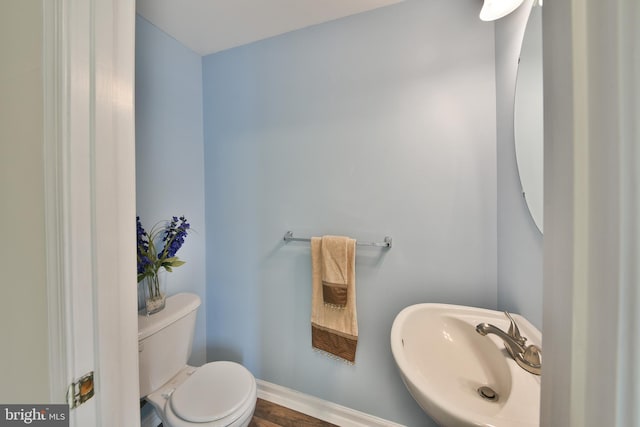 bathroom with sink and toilet