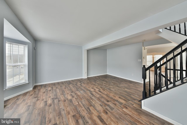 spare room featuring dark hardwood / wood-style flooring