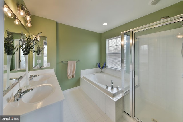 bathroom with vanity, shower with separate bathtub, and tile patterned flooring