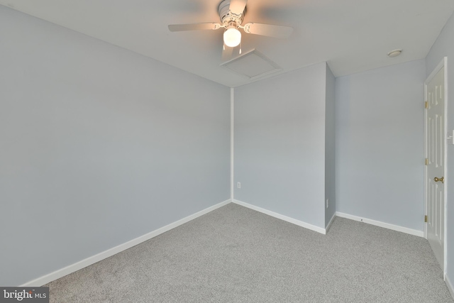 empty room featuring ceiling fan and light carpet