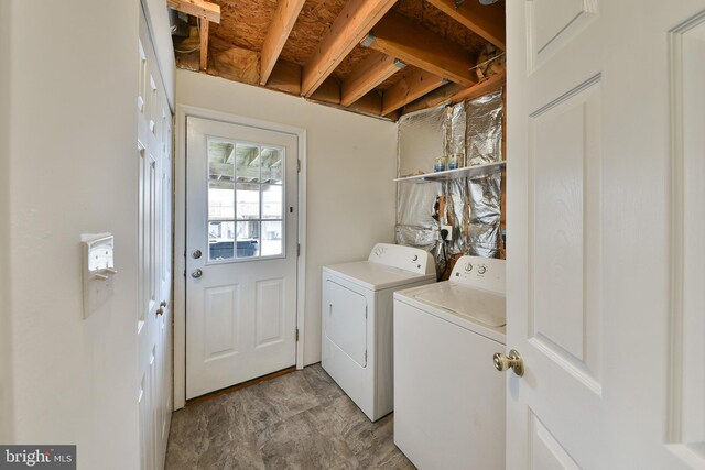 washroom with washing machine and dryer