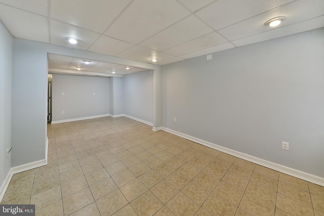 basement featuring a drop ceiling