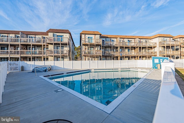 view of swimming pool with a patio