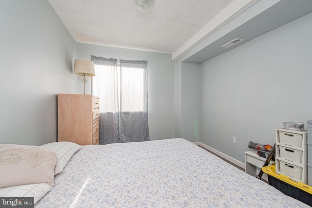 bedroom with a textured ceiling