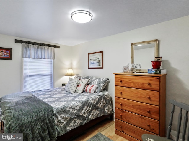 bedroom with light wood-type flooring