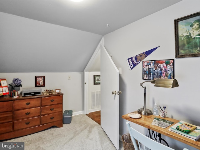 bedroom featuring lofted ceiling and carpet floors