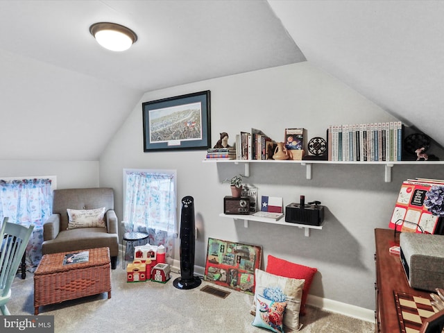 playroom featuring lofted ceiling and carpet floors