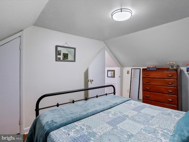 bedroom with lofted ceiling