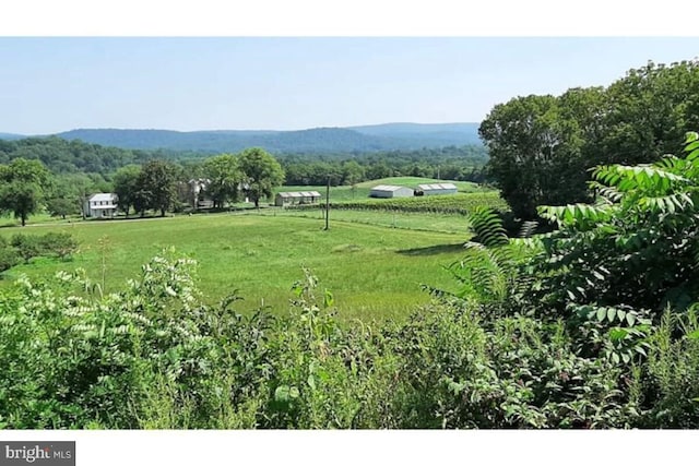 mountain view featuring a rural view