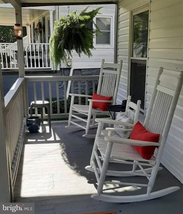 wooden deck featuring a porch