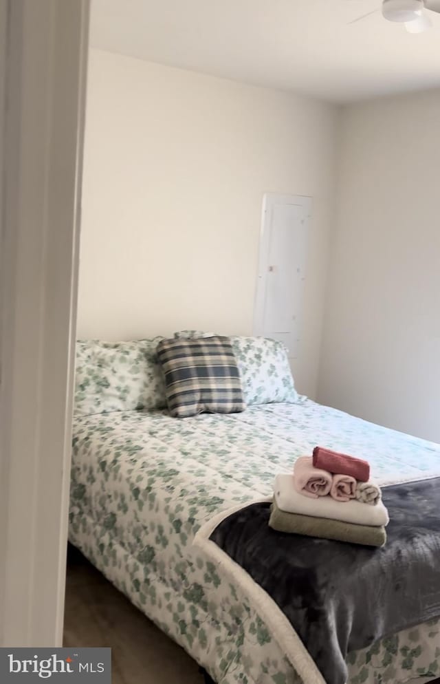 bedroom with dark hardwood / wood-style flooring