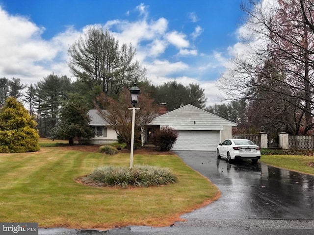 exterior space with a garage and a front yard