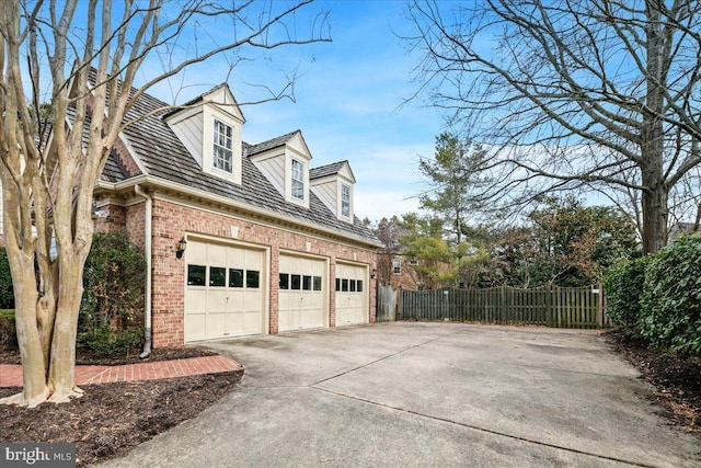 view of property exterior featuring a garage