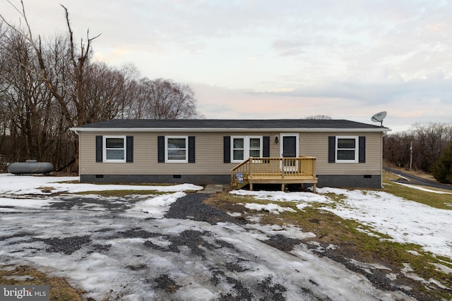 view of front of home with a wooden deck