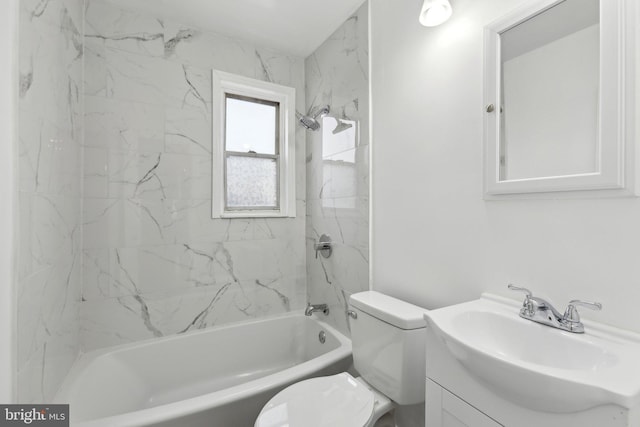 full bathroom with vanity, tiled shower / bath combo, and toilet