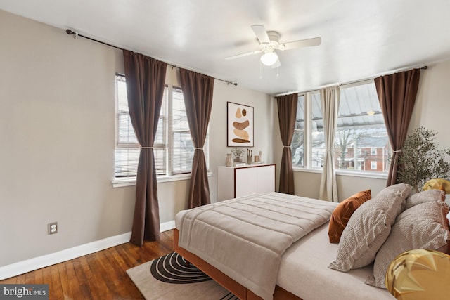 bedroom featuring dark hardwood / wood-style floors and ceiling fan