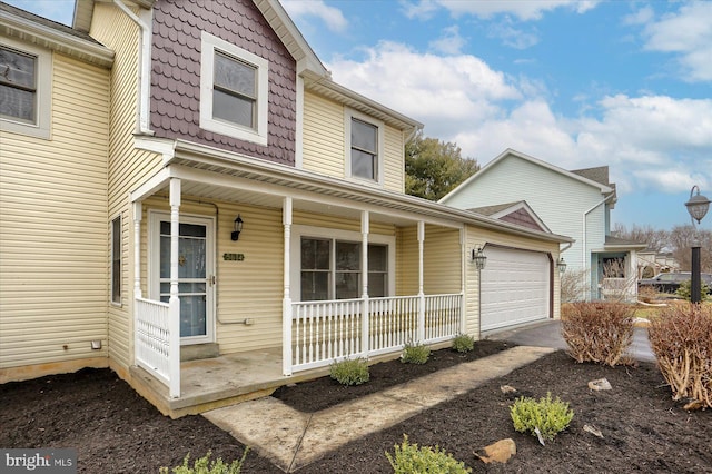 view of front facade with a porch and a garage