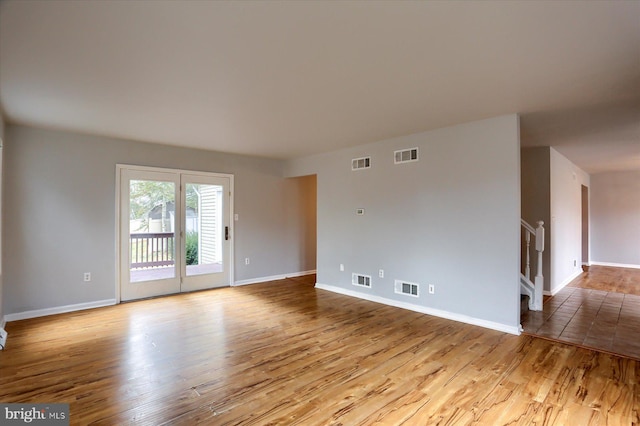 spare room with light hardwood / wood-style flooring