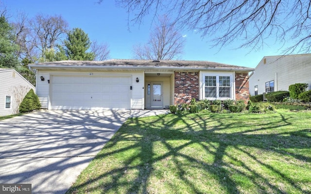 ranch-style home with a garage and a front yard